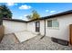 Backyard patio with a gray stone ground cover and access to the home at 2999 S Adams St, Denver, CO 80210