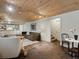 Basement living area featuring a kitchenette, lounge area, and access to stairs at 1985 Union St, Lakewood, CO 80215