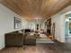 Spacious basement living area with hardwood floors, fireplace, and recessed lighting at 1985 Union St, Lakewood, CO 80215
