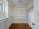 Walk-in closet with custom shelving and hardwood floors at 1985 Union St, Lakewood, CO 80215