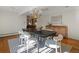 Bright dining room featuring a modern chandelier and a view into the living space at 1985 Union St, Lakewood, CO 80215