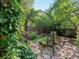 An elegant iron arbor welcomes you to this lushly landscaped garden with a winding stone path at 1985 Union St, Lakewood, CO 80215
