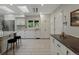 Spacious kitchen with white cabinetry, granite countertops, and wood flooring at 1985 Union St, Lakewood, CO 80215
