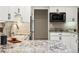 Well-lit kitchen with granite countertops, stainless steel appliances, and white cabinetry at 1985 Union St, Lakewood, CO 80215