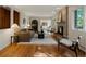 Inviting living room with a brick fireplace, hardwood floors, and an open layout at 1985 Union St, Lakewood, CO 80215