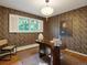 Stylish home office featuring patterned wallpaper, a modern desk, and natural light at 1985 Union St, Lakewood, CO 80215