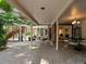 This large outdoor patio includes a dining area, stone flooring, and access to the interior and backyard at 1985 Union St, Lakewood, CO 80215