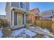 Private backyard with wooden fence and shed at 10251 E 62Nd Pl, Denver, CO 80238