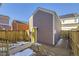 Private backyard with wooden fence and shed at 10251 E 62Nd Pl, Denver, CO 80238