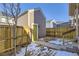 Private backyard with wooden fence and shed at 10251 E 62Nd Pl, Denver, CO 80238