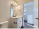 Bathroom showcasing vanity with modern lighting and white hardware at 10251 E 62Nd Pl, Denver, CO 80238