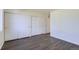 Bedroom with grey floors and ample closet space at 10251 E 62Nd Pl, Denver, CO 80238