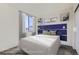 Well-lit bedroom featuring a statement headboard and modern window treatments at 10251 E 62Nd Pl, Denver, CO 80238