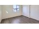 Bedroom featuring grey floors, window, and closet at 10251 E 62Nd Pl, Denver, CO 80238