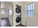 Stackable washer and dryer in laundry closet at 10251 E 62Nd Pl, Denver, CO 80238