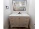 Stylish bathroom vanity with modern fixtures, sleek countertop, and large mirror reflecting a tiled shower at 14546 Pine View Rd, Larkspur, CO 80118