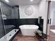 Modern bathroom featuring a soaking tub, walk-in shower and stylish decor at 14546 Pine View Rd, Larkspur, CO 80118