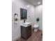 Modern bathroom with stylish vanity, square sink, black faucet, sleek mirror, and floating shelves at 14546 Pine View Rd, Larkspur, CO 80118