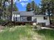 Stylish home featuring a spacious deck, black frame windows and walkout basement at 14546 Pine View Rd, Larkspur, CO 80118