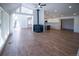 Spacious living room with high ceilings, wood floors, natural light, and a cozy fireplace at 14546 Pine View Rd, Larkspur, CO 80118