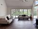 Bright living room featuring two sofas, vaulted ceilings, wood floors and an expansive view at 14546 Pine View Rd, Larkspur, CO 80118