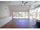Bright living room with high vaulted ceilings, large windows, and hardwood flooring at 14546 Pine View Rd, Larkspur, CO 80118