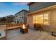 Inviting back deck with built-in seating, fire pit, and grill, perfect for outdoor entertaining at 7734 Blue Water Dr, Castle Rock, CO 80108