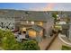 Spacious backyard features a large deck, mature trees, and privacy fencing at 7734 Blue Water Dr, Castle Rock, CO 80108