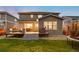 A home with a private fenced backyard featuring a well-maintained deck with outdoor furniture at 7734 Blue Water Dr, Castle Rock, CO 80108