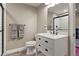 Bathroom featuring a vanity with a marble countertop, a modern sink, and tiled floors at 7734 Blue Water Dr, Castle Rock, CO 80108