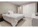 Well-lit bedroom featuring a cozy bed, closet with sliding doors, and neutral decor at 7734 Blue Water Dr, Castle Rock, CO 80108