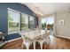 Dining area with natural light from three windows plus a glass patio door leading to an outdoor deck at 7734 Blue Water Dr, Castle Rock, CO 80108