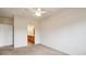A carpeted bedroom featuring a ceiling fan at 10725 Eliot Cir # 102, Denver, CO 80234