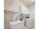 A laundry room with a washing machine, dryer, and a freezer at 10725 Eliot Cir # 102, Denver, CO 80234