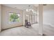 Bright living room with big windows and glass doors showing off the outdoor view at 10725 Eliot Cir # 102, Denver, CO 80234