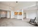 Spacious living room with an open floor plan and a kitchen bar, perfect for entertaining at 10725 Eliot Cir # 102, Denver, CO 80234