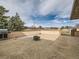 Backyard patio with a built-in grill and an outdoor fire pit ready for entertaining at 15955 W 52Nd Dr, Golden, CO 80403