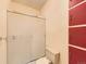 Bathroom featuring a shower stall, tiled walls, and standard toilet, offering functionality at 15955 W 52Nd Dr, Golden, CO 80403