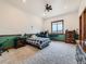 Spacious bedroom with natural light, carpet flooring, ceiling fan, and ample space for furniture at 15955 W 52Nd Dr, Golden, CO 80403