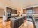 Spacious kitchen featuring stainless steel appliances, a large island, and rich wooden cabinetry at 15955 W 52Nd Dr, Golden, CO 80403