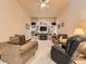 Cozy living room with a fireplace, built-in shelving, comfortable seating, and soft carpeting at 15955 W 52Nd Dr, Golden, CO 80403