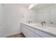 Contemporary bathroom features dual sinks, stylish mirrors, and modern fixtures at 1294 S Algonquian St, Aurora, CO 80018