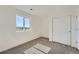 Comfortable bedroom with soft carpet, natural light from a large window, and a closet at 1294 S Algonquian St, Aurora, CO 80018