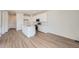 Modern kitchen features white cabinetry, stainless steel appliances, and a center island at 1294 S Algonquian St, Aurora, CO 80018
