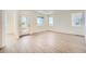 Bright living room with lots of natural light boasts sleek wood-look floors and neutral walls at 1294 S Algonquian St, Aurora, CO 80018