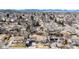 Overhead shot of a community neighborhood, emphasizing the property's setting with mountain views in the distance at 7559 Jay Ct, Arvada, CO 80003