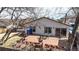 Backyard deck with outdoor seating, fire pit, and barbecue, ideal for entertaining at 7559 Jay Ct, Arvada, CO 80003