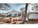 Backyard with deck, shed, and an inviting outdoor space perfect for entertaining, surrounded by well-kept landscaping at 7559 Jay Ct, Arvada, CO 80003