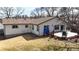 Spacious backyard featuring a wooden deck with outdoor seating, offering a serene space for relaxation and entertainment at 7559 Jay Ct, Arvada, CO 80003