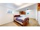 Basement bedroom featuring dual windows, built in shelving, and ample lighting at 7559 Jay Ct, Arvada, CO 80003